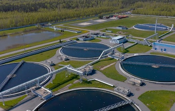 Aerial view of the wastewater treatment plant. Pumping station and drinking water supply. Industrial and urban water treatment for a big city. Round sedimentation tanks.